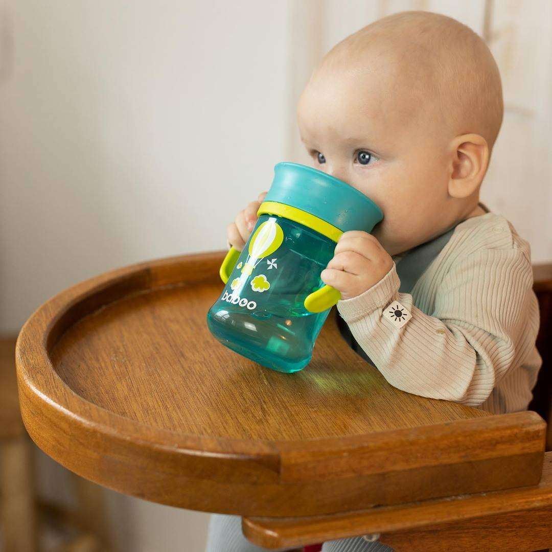 A Baboo cup with an innovative design that prevents spilling, with a silicone valve that opens when your child starts to drink and closes when they stop.