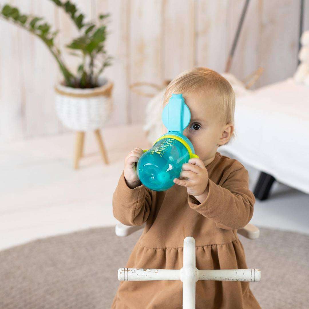 A Baboo cup with a soft and durable silicone straw that protects your child's sensitive teeth and gums, and a gravity ball that helps them drink every drop.