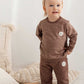 Baby Jumper Snails 297 pairs perfectly with two of this collection’s trousers and shorts. 