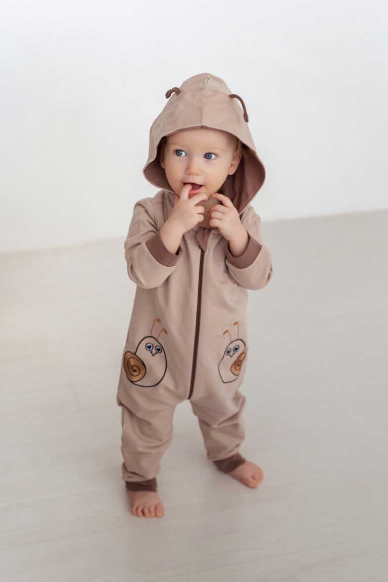 Cute boy feeling playfull while wearing Infant Overall Snails 287