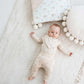 Cute baby wearing infant bodysuit Bear and Bunny 368 with baby pants and baby scarf from the same Bear and Bunny collection