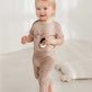Happy blonde child wearing snail pants and snail bodysuit, a full snail outfit! 